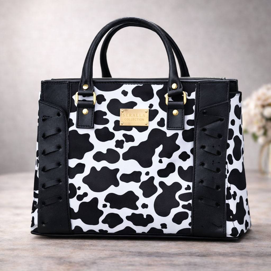 Bolso Estampado Vaca con Agujetas Negras